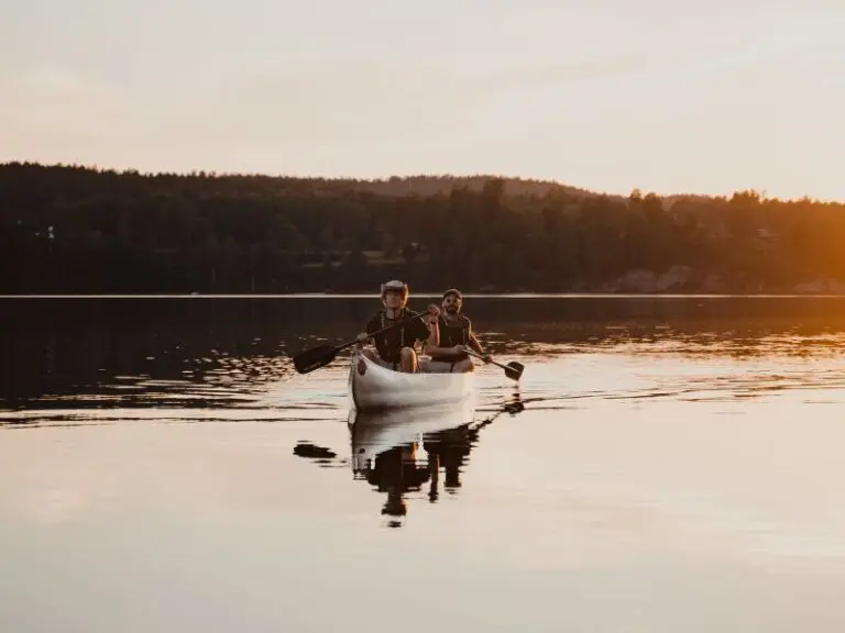 2 people in paddling in a Canoe in Sweden