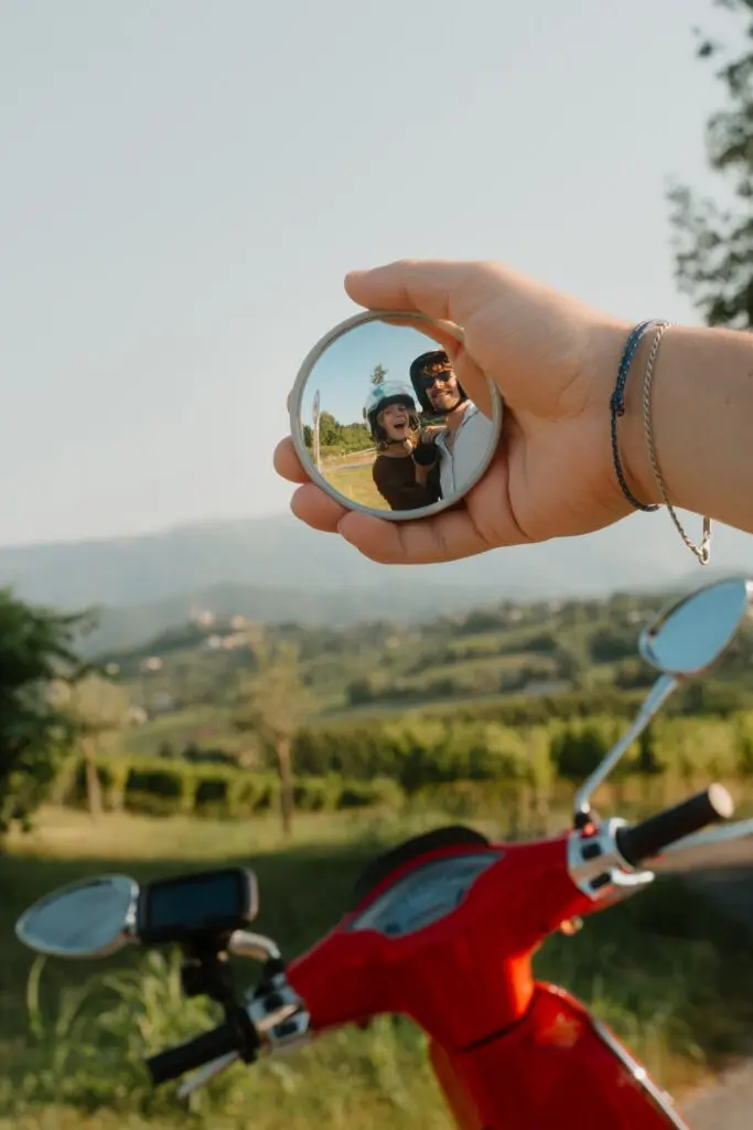 couple in scooter mirror selfie in Veneto countryside