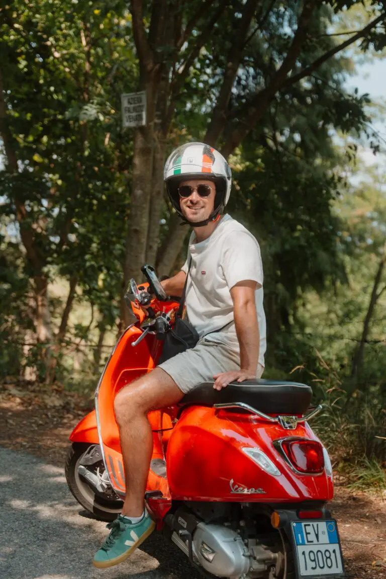 man on red Vespa scooter in Veneto, Italy